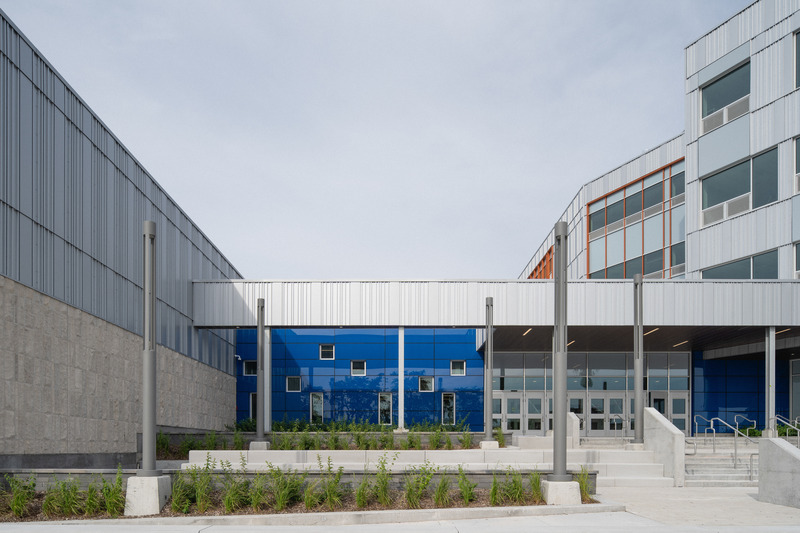 Press kit | 1387-14 - Press release | Adaptable, Sustainable and Inclusive: Two New High Schools Rethink the Learning Environment for Montreal Students - TLA+UN+NEUF - Institutional Architecture -   <p class="">One of the four building entrances – Aux Mille-Voix high school</p>   - Photo credit: Raphaël Thibodeau