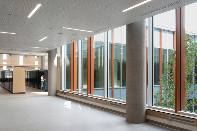 Press kit | 1387-14 - Press release | Adaptable, Sustainable and Inclusive: Two New High Schools Rethink the Learning Environment for Montreal Students - TLA+UN+NEUF - Institutional Architecture -   <p class="">Locker area opening to the inner courtyard – Aux Mille-Voix high school</p>   - Photo credit: Raphaël Thibodeau