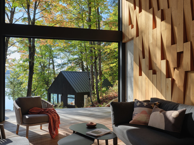 Press kit | 7600-02 - Press release | Shield and Shelter: An Embracing Lakeside Family Retreat that Opens Intimately and Sensitively to its Untamed Surroundings in the Heart of the Muskoka Region - Barbora Vokac Taylor Architect Inc. (BVT A) - Residential Architecture -   View from Muskoka Room: Artist Victoria Fard's intricate light pattern in cedar panels adds warmth to the double-height space.   - Photo credit: Doublespace
