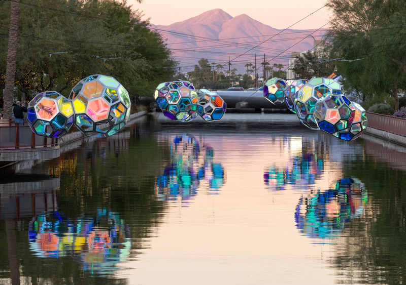 Press kit | 5595-10 - Press release | Molecules: A Series of Interactive Water Molecules Rising up from the Arizona Canal, Sparking a Connection Between Visitors and the Surrounding Environment Through Light and Sound - The Urban Conga - Multimedia Design - Reflections of Molecules on the Arizona Canal with the McDowell Mountain Range in the background.  - Photo credit:  Andrew Pielage 
