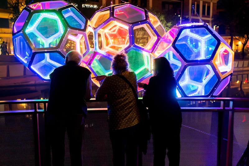 Press kit | 5595-10 - Press release | Molecules: A Series of Interactive Water Molecules Rising up from the Arizona Canal, Sparking a Connection Between Visitors and the Surrounding Environment Through Light and Sound - The Urban Conga - Multimedia Design - Visitors playing with the lighting of Molecules through their voice.  - Photo credit: Charles Darr