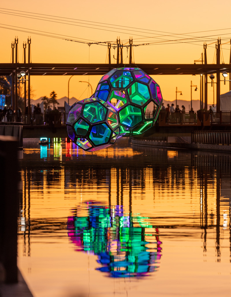 Press kit | 5595-10 - Press release | Molecules: A Series of Interactive Water Molecules Rising up from the Arizona Canal, Sparking a Connection Between Visitors and the Surrounding Environment Through Light and Sound - The Urban Conga - Multimedia Design - Molecules during sunset at the Canal Convergence event in Scottsdale, Arizona.  - Photo credit: Andrew Pielage