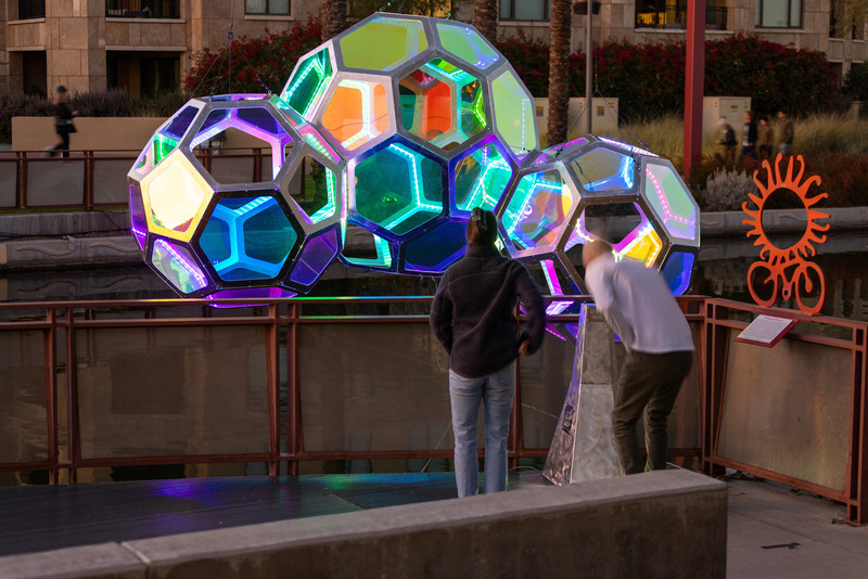 Press kit | 5595-10 - Press release | Molecules: A Series of Interactive Water Molecules Rising up from the Arizona Canal, Sparking a Connection Between Visitors and the Surrounding Environment Through Light and Sound - The Urban Conga - Multimedia Design - A couple sees how their voice begins to have impact on the work.  - Photo credit: Andrew Pielage
