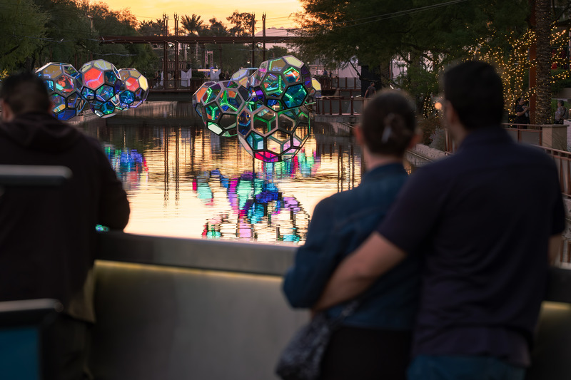 Press kit | 5595-10 - Press release | Molecules: A Series of Interactive Water Molecules Rising up from the Arizona Canal, Sparking a Connection Between Visitors and the Surrounding Environment Through Light and Sound - The Urban Conga - Multimedia Design - Visitors taking in the work on the Soleri Bridge on the Arizona Canal.  - Photo credit: Charles Darr