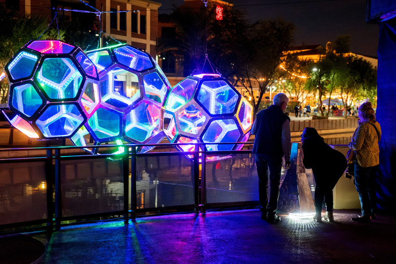 Press kit | 5595-10 - Press release | Molecules: A Series of Interactive Water Molecules Rising up from the Arizona Canal, Sparking a Connection Between Visitors and the Surrounding Environment Through Light and Sound - The Urban Conga - Multimedia Design - Visitors playing with the lights using their voices.  - Photo credit: Charles Darr
