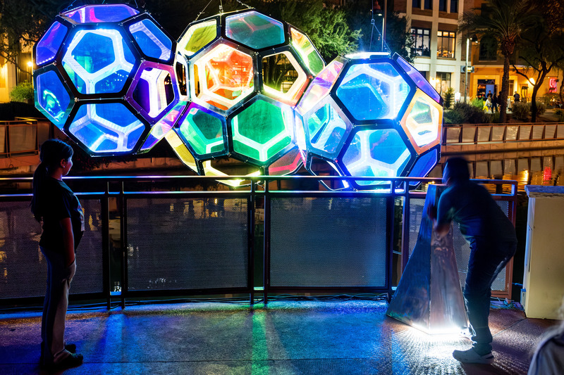Press kit | 5595-10 - Press release | Molecules: A Series of Interactive Water Molecules Rising up from the Arizona Canal, Sparking a Connection Between Visitors and the Surrounding Environment Through Light and Sound - The Urban Conga - Multimedia Design - A kid yells into the work to see his voice shift and change the lighting.  - Photo credit: Charles Darr