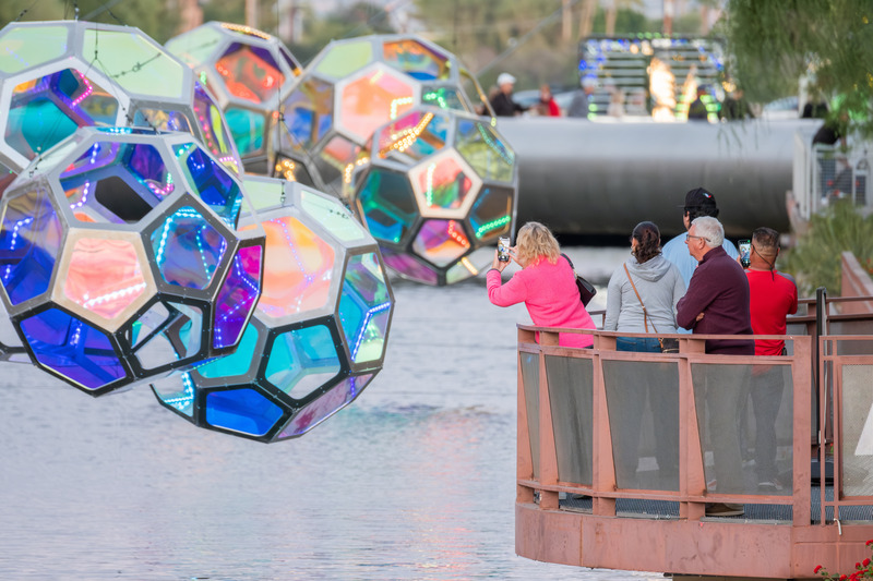 Press kit | 5595-10 - Press release | Molecules: A Series of Interactive Water Molecules Rising up from the Arizona Canal, Sparking a Connection Between Visitors and the Surrounding Environment Through Light and Sound - The Urban Conga - Multimedia Design - The forms hug the edge of the canal in parts to allow visitors to get close and capture different reflections of color and light.  - Photo credit: Charles Darr