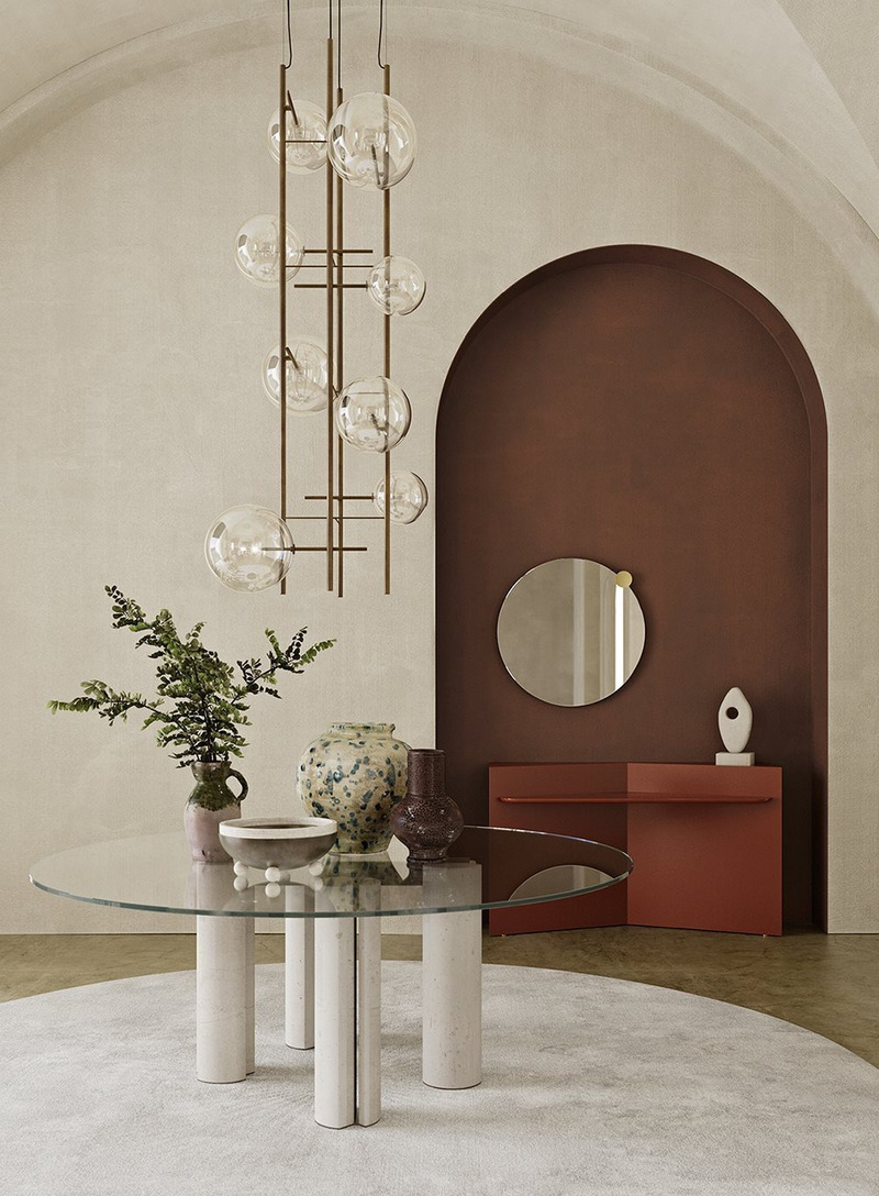 Dossier de presse | 7656-01 - Communiqué de presse | Fendi Casa, Dolce & Gabbana Casa, Versace Home, Bentley Home et Gallotti & Radice rejoignent Maison Territo au Royalmount, marquant un tournant pour le design italien à Montréal - Maison Territo - Design d’intérieur résidentiel - Épure et modernité pour cette composition signée Gallotti&amp;Radice : une table ronde en verre posée sur des colonnes sculpturales, sublimée par un mur terracotta et une suspension graphique. Une entrée tout en équilibre et en raffinement, chez Maison Territo. - Crédit photo : Gallotti&amp;Radice