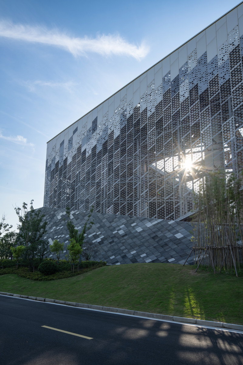 Press kit | 5086-03 - Press release | Baoshan Waste-to-Energy Center Transforms Shanghai's Industrial Legacy into Green Landmark - Ballistic Architecture Machine (BAM) - Industrial Architecture - Sunlight filters through the perforated façade, designed for airflow to the industrial programs within. - Photo credit: Derryck Menere 