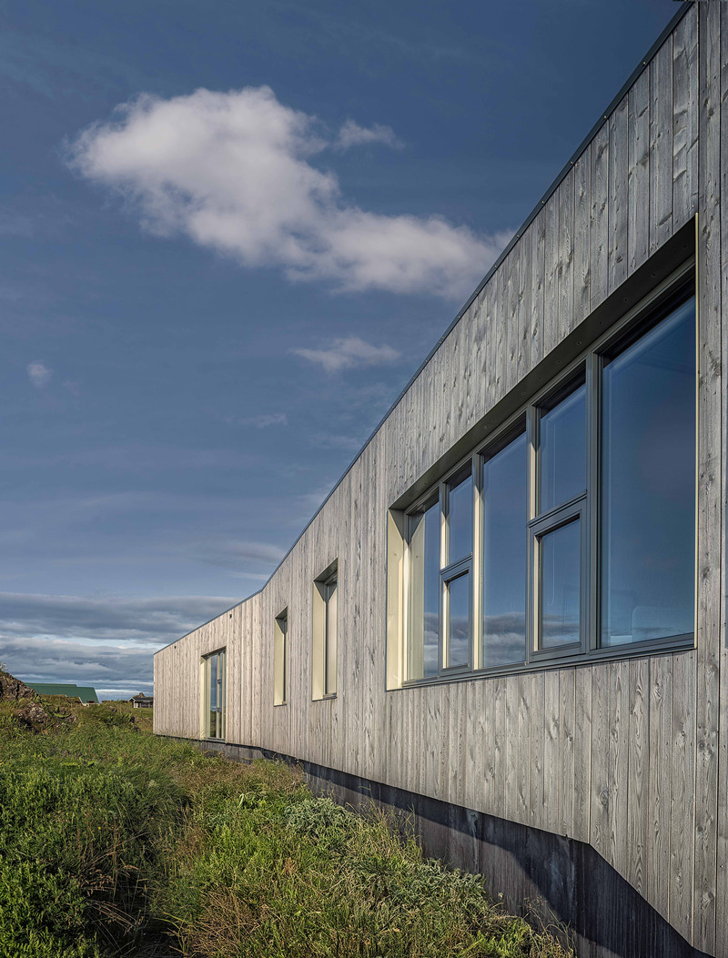 Press kit | 6422-01 - Press release | Visitor Center for Snæfellsjökull National Park - Arkis Architects - Commercial Architecture - The exterior walls of the building are clad in two different types of timber cladding. - Photo credit: Karl Vilhjálmsson