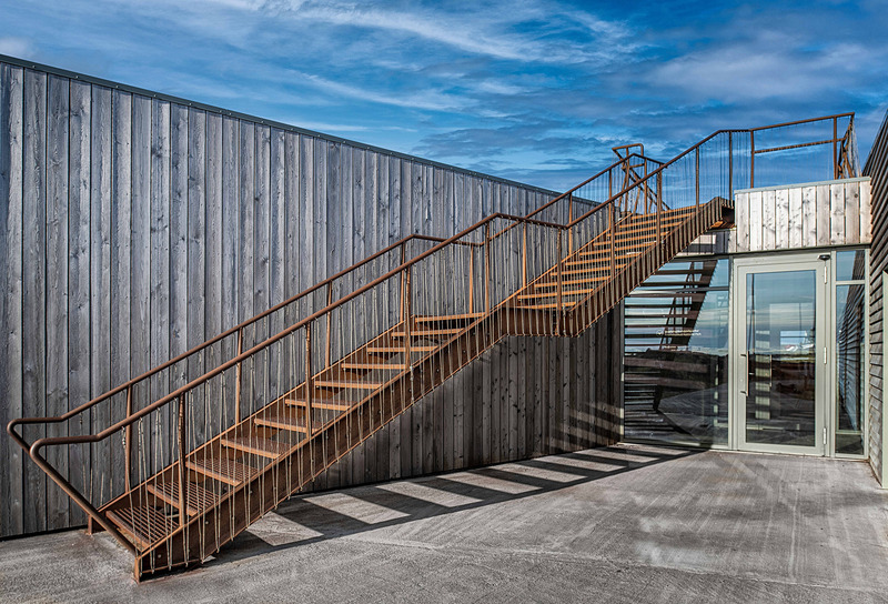 Press kit | 6422-01 - Press release | Visitor Center for Snæfellsjökull National Park - Arkis Architects - Commercial Architecture - Stairs on both sides of the building lead up to the rooftop observation deck, which offers panoramic views of Snæfellsjökull glacier and the village Hellisandur. - Photo credit: Karl Vilhjálmsson