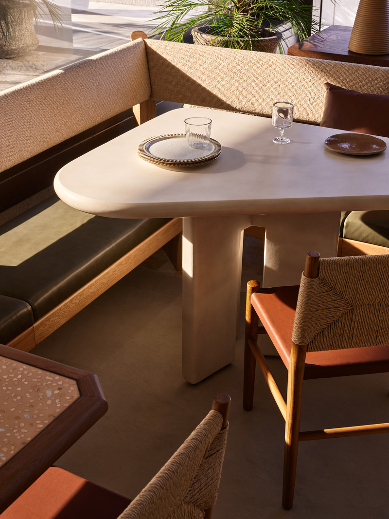 Press kit | 2887-11 - Press release | Opening Mondrian Gold Coast, Australia - Alexander &CO. - Commercial Interior Design -  Haven - Morning light captured on custom concrete table and banquette seating - Photo credit: Alicia Taylor