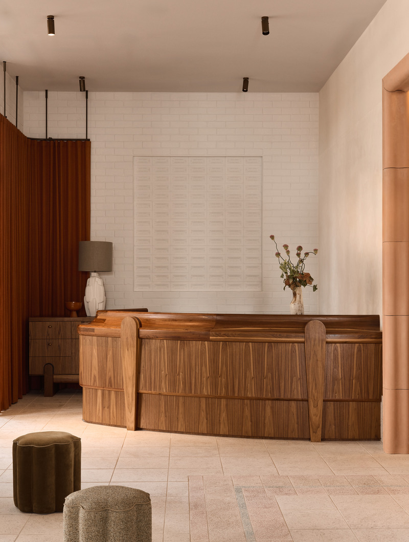 Press kit | 2887-11 - Press release | Opening Mondrian Gold Coast, Australia - Alexander &CO. - Commercial Interior Design -  Mondrian Gold Coast hotel reception featuring custom walnut desk by Hugh McCarthy and feature wall with custom 'Any Way You Want' brick made in collaboration with Natural Brick Company - Photo credit:  Alicia Taylor 