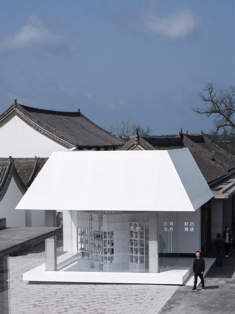 Press kit | 7730-01 - Press release | The White is Good Shop in Weipo, Luoyang - designRESERVE - Commercial Architecture - View of White Is Good Shop against back drop of the Weipo village  - Photo credit: Huaer Lin