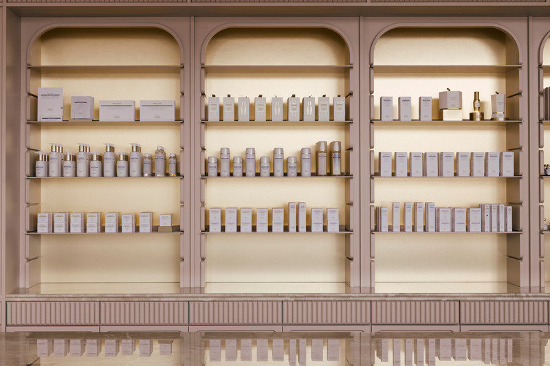 Press kit | 6188-01 - Press release | Living Beauty Retail Space and Treatment Spa - ODAMI - Commercial Interior Design - Behind the main counter,<br>gold-toned product bays distinguish prestige<br>products and brands.<br> - Photo credit: John Alunan