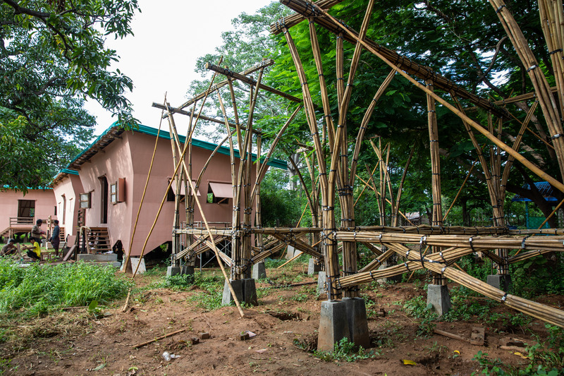 Press kit | 7035-02 - Press release | Bamboo Housing Resists 7.7 Earthquake in Conflict-Torn Myanmar, Built for Displaced Families - Blue Temple - Institutional Architecture - <table id="78fb2e8e-ccd5-71d3-4b7e-db66434305eb" data-aloha-ephemera-attr="id" class="aloha-ephemera-attr"><tbody><tr>   <td style=""> </td></tr></tbody></table>Construction phase of modular bamboo housing, with IDP-built units visible in the background. - Photo credit: Aung Htay Hlaing