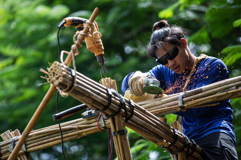 Press kit | 7035-02 - Press release | Bamboo Housing Resists 7.7 Earthquake in Conflict-Torn Myanmar, Built for Displaced Families - Blue Temple - Institutional Architecture - Worker fabricating bundled bamboo connections with hand tools on site. - Photo credit: Aung Htay Hlaing
