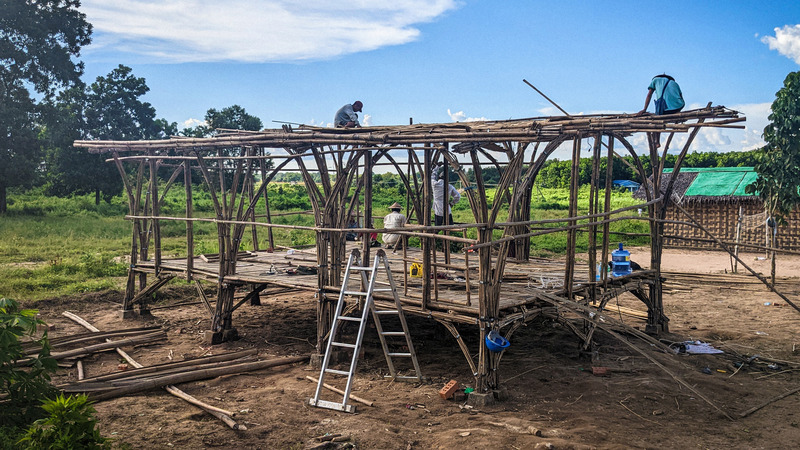 Press kit | 7035-02 - Press release | Bamboo Housing Resists 7.7 Earthquake in Conflict-Torn Myanmar, Built for Displaced Families - Blue Temple - Institutional Architecture - Construction site of Hmawbi bamboo pre-school, with bamboo structure partially completed. - Photo credit: Raphaël Ascoli