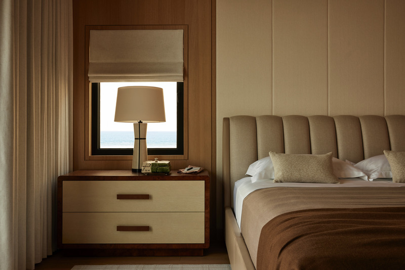Press kit | 6087-07 - Press release | Study in Serenity: A Beachside Haven of Precision and Craftsmanship - Daniel Joseph Chenin - Residential Interior Design - Custom furniture by Daniel Joseph Chenin, including nightstands and a credenza in burl wood, complements the bedroom’s tailored millwork and Holly Hunt bed frame, blending craftsmanship with material richness to create a serene, cohesive retreat. - Photo credit: Tim Hirschmann
