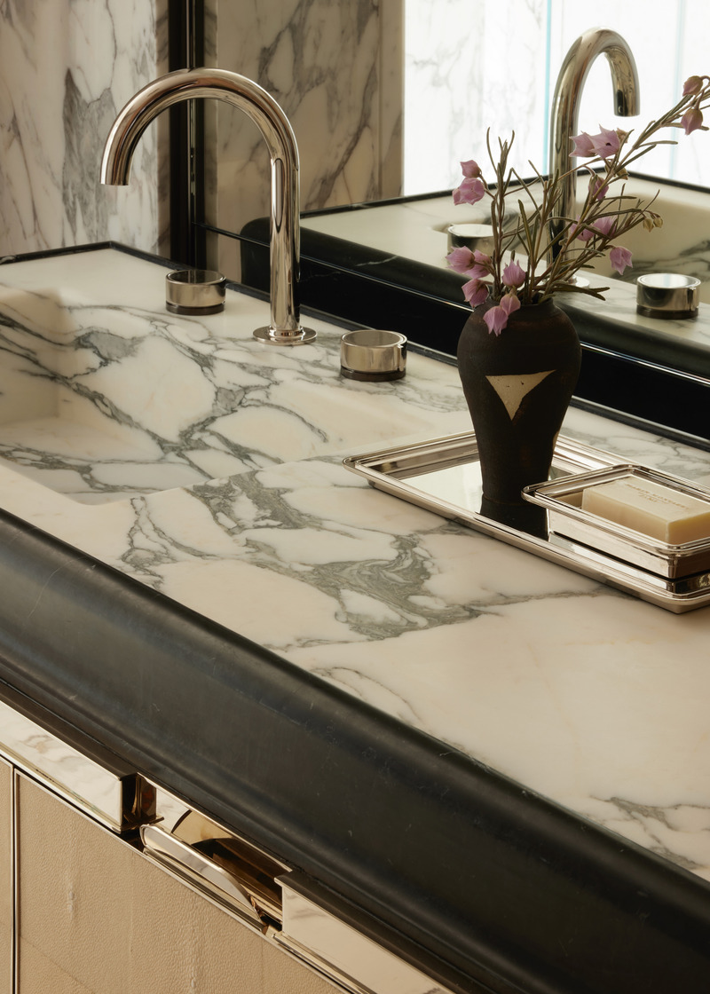 Press kit | 6087-07 - Press release | Study in Serenity: A Beachside Haven of Precision and Craftsmanship - Daniel Joseph Chenin - Residential Interior Design - An intimate detail of the custom vanity by Daniel Joseph Chenin, where veined marble meets nickel trim and stingray drawers, capturing the project’s ethos of tactile richness and refined precision, completed with Bond faucets by Waterworks. - Photo credit: Tim Hirschmann