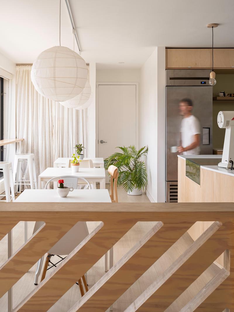 Press kit | 1513-09 - Press release | Lion Coffee - Dubbeldam Architecture + Design - Commercial Interior Design - The space is designed for versatility, with movable tables and track-mounted rice paper lanterns that can be rearranged to suit casual meetups or tasting events. - Photo credit: Scott Norsworthy