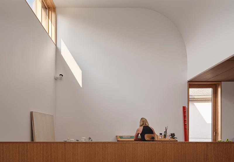 Press kit | 2682-02 - Press release | House of Monitors - Williamson Williamson Inc. - Residential Architecture - The owner working in her painting studio with operable north facing clerestory. - Photo credit: Doublespace Photography