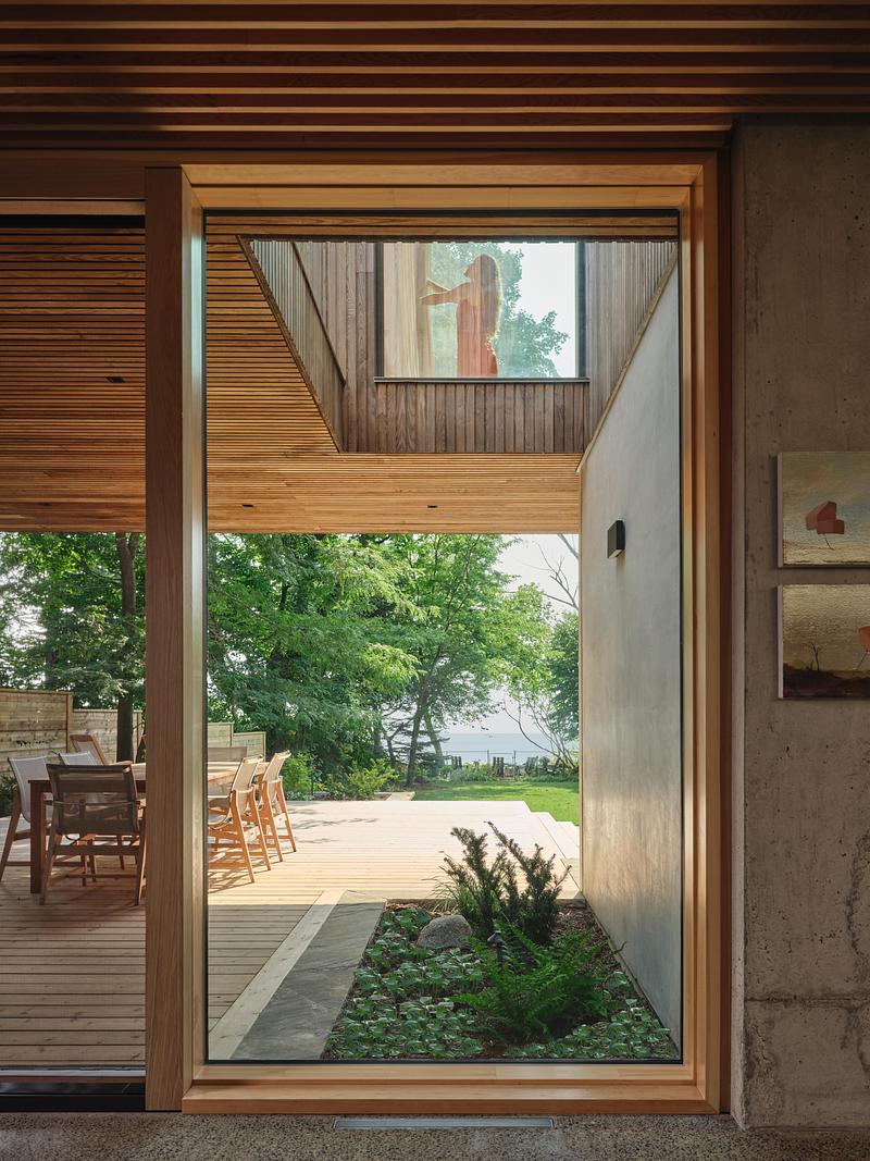 Press kit | 2682-02 - Press release | House of Monitors - Williamson Williamson Inc. - Residential Architecture - Looking south from the kitchen under the cantilever deck above, you glimpse the primary bedroom above.  - Photo credit: Doublespace Photography