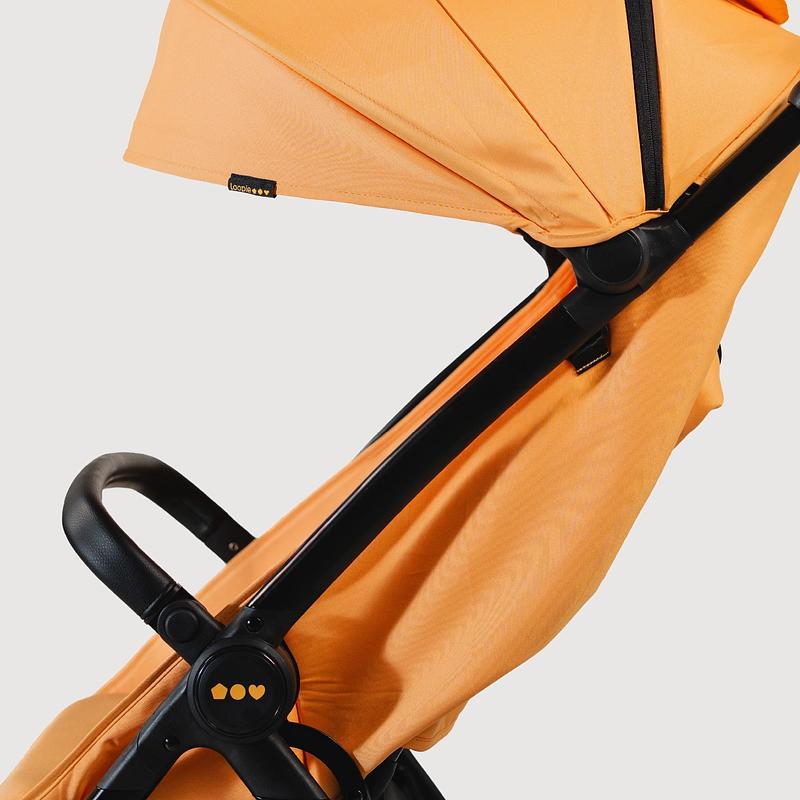Press kit | 7831-01 - Press release | Morrama Collaborates with Female-led Indian Startup Loopie to Redefine The Baby Stroller - Morrama - Industrial Design - Orange Loopie Stroller frame - Photo credit: Morrama