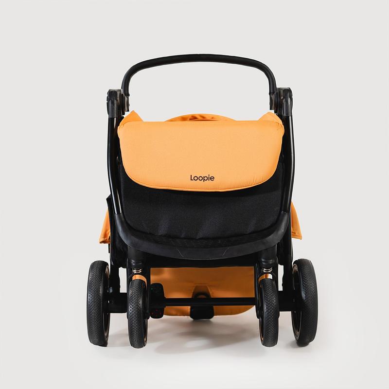 Press kit | 7831-01 - Press release | Morrama Collaborates with Female-led Indian Startup Loopie to Redefine The Baby Stroller - Morrama - Industrial Design - Orange Loopie Stroller folded - Photo credit: Morrama