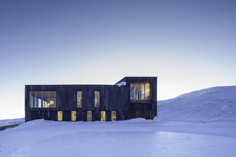 Press kit | 2757-60 - Press release | A Carefully-Crafted Winter Retreat by Sparano + Mooney Architecture Is Inspired by the Japanese Art of Kirigami - Sparano + Mooney Architecture - Residential Architecture -  The home’s custom, bent-metal TEKKō™ steel exterior wraps around the structure in a mixture of solid and perforated panels.  - Photo credit:  Matt Winquist 