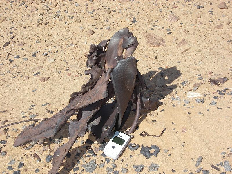 Press kit | 748-54 - Press release | UQAM’s Centre de design Presents "Toxicité coloniale : Architecture et paysage radioactifs français dans le Sahara" - Centre de design de l'UQAM - Event + Exhibition -  <p style="">Metals “Blue Gerboise”, 2007. Various metals and materials abandoned in the Sahara around the former Saharan Military Testing Center, Reggane, 2007.</p>  - Photo credit: Bruno Barrillot. With kind permission of the Armaments Observatory (https://www.obsarm.info/). 