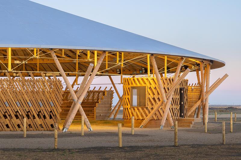 Press kit | 7916-01 - Press release | Rooted in Culture: The Muscowpetung Powwow Arbour Wins Architizer A+ Award and Canada's Governor General’s Medal in Architecture - Oxbow Architecture & Richard Kroeker - Institutional Architecture - <p class="">Exterior image of Arbour at daybreak showing announce booth and grand entry</p> - Photo credit: Lindsay Reid<span></span>
