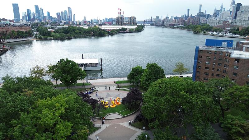 Press kit | 5595-13 - Press release | The Urban Conga Unveils “Revolving Voices” at New York Public Housing in Collaboration with Local Poet Tamra Cosby - The Urban Conga - Art - Revolving Voices sits at Hallet's Cove overlooking the Manhattan skyline.  - Photo credit: Ryan Swanson