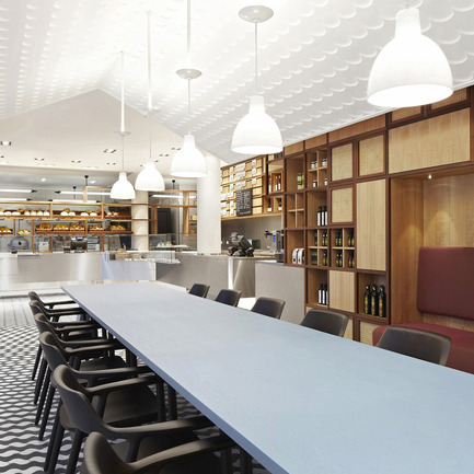 Press kit | 902-02 - Press release | A’ Design Awards 2014 Winners Announced - A' Design Award and Competition - Competition - Das Brot.&nbsp;<br>Bread Bakery and Restaurant by Designliga<br><br>PROJECT DESCRIPTION:<br>TASK: Design and realization of the interior design (LP 1-8) and corporate design including packaging for the bread bakery “Das Brot.” at the Autostadt in Wolfsburg. As the communications platform of the Volkswagen Group, the Autostadt in Wolfsburg brings the values of Volkswagen to life. The restaurants at the Autostadt are operated by the Swiss company Mövenpick. All foods used at the Autostadt are selected with a view to the transparency and regionality of all growers, producers and production methods. All foods served in the bread bakery “Das Brot.” are 100 per cent organic. SOLUTION: “Das Brot.“ has a design concept that shows off high-quality local materials and focusses on traditional artisan crafts. In the functional areas of the restaurant, the bakery and dining area flow into each other, creating a constantly changing ambient perspective. From the clean, clear lines of the ‘workshop’ area to the homely familiarity of the long table where guests sit down together, the feeling created by the restaurant space shifts and transforms. The patterns of the floor echo the breadmaking process, in which a metamorphosis takes place from field to wheat, from wheat to flour and from flour - with water - to bread. The symbolic presentation of this creative process has both narrative and decorative value. At the same time, the floor design bears witness to an uncompromising quality of craftsmanship. - Photo credit: Designliga; photographer: Pascal Gambarte, 2013.