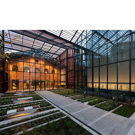 Press kit | 902-02 - Press release | A’ Design Awards 2014 Winners Announced - A' Design Award and Competition - Competition - Malopolska Garden of Arts (MGA)&nbsp;<br>Performing arts centre &amp; mediatheque by Ingarden &amp; Ewý Architects<br><br>PROJECT DESCRIPTION:<br>The building of MGA introduced new spatial order to the old backyards and ruined buildings in Rajska and Szujskiego streets in Krakow. The starting point was a multifunctional hall, which was entered into the outline of the old, 19th-century horse-riding arena, used in the last years of its history as workshops and storage space for the Juliusz Słowacki Theatre in Kraków. The Małopolska Garden of Arts is a cross between two institutions: the Juliusz Słowacki Theatre and the Malopolska Voivodeship Library. The wing on Szujskiego street holds a modern art and media library, with multimedia books and music, while the section standing on Rajska street has been developed by the theatre, and is equipped with a multifunctional events hall. The new hall – operating, as a studio theatre, conference room, concert hall, and venue for banquets and exhibitions – holds retractable stages for 300 people. State-of-the-art stage technology is present overhead: fixed on hoists and cranes to the steel ceiling girders. This allows dramas and concerts to be performed, and exhibitions, film screenings, symposiums, conferences, art auctions, fashion shows, and many more events to be held. Altogether, the space of about 4300 sq.m houses a theatre together with a cosy cinema with 98 seats, a café, and premises for the organisation of educational, art-related activities. Honing the form, the architects focused on interaction with the future recipients, which is why the entire spatial form of the symbolic, openwork roofing raised over the garden from the side of Rajska Street – though not functioning as an actual roof – is there to transport the gateway to the stage out onto the street. In this way, the building delicately nudges passers-by with the skilful manipulation of the form, already at first glance giving the onlooker the impression of going beyond the borders of a garden, where culture is grown in evenly planted rows. Further proof of the sophisticated play with the space is the garden itself. Imitating flower beds, the equal bands with low greens are a metaphor of a garden: as much as the architects could afford here. A notable fact is that historically “ulica Rajska” – literally “Paradise Street” – led to the Garden of Paradise, which was later replaced by the developments of the Tobacco Works. The final impact is the result of the designers’ sensitivity to signals coming from the environment. For example, the opening in the perforated roof of the garden was formed, especially for the maple tree that grows there. In this place, the cultural life of the Kraków’s young artistic set will blossom under a shared roof. Modern ballet, contemporary theatre forms, audio and video arts, concerts, and all and any other artistic pursuits will find their home here. - Photo credit: Marcin Czechowicz / MURATOR ©, 201