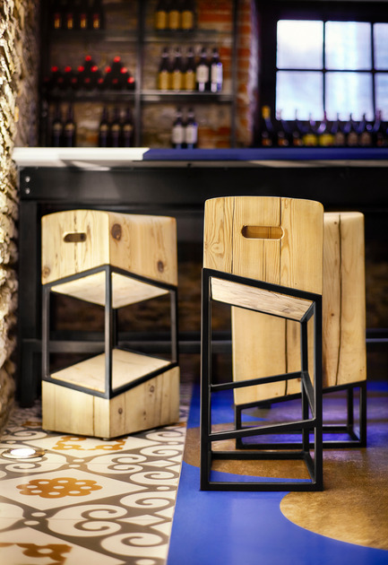 Press kit | 1048-09 - Press release | Spanish-inspired tapas restaurant Barsa Taberna captures the energy of the running of the bulls - +tongtong - Commercial Interior Design -  Dubbed the "little pest", or in Spanish "becho mio" the custom-designed stools are made of salvaged pine. They come in three variations, all of which look different depending on their orientation. Tops resembles worn butcher blocks with carved-out handles that riff on the forms of old wine crates.<br>  - Photo credit: Lisa Petrole Photography<br>