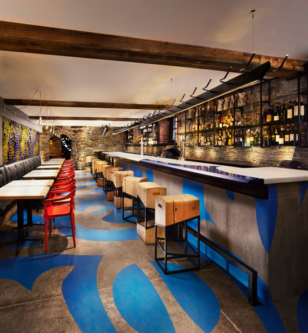 Press kit | 1048-09 - Press release | Spanish-inspired tapas restaurant Barsa Taberna captures the energy of the running of the bulls - +tongtong - Commercial Interior Design - The bar area is defined by a swirling, vibrant blue graphic floor pattern, a design that was extrapolated from the Gaudi influenced tile in the main dining room. The design runs up the sides of the kitchen walls and the bar.<br> - Photo credit: Lisa Petrole Photography&nbsp;<br>