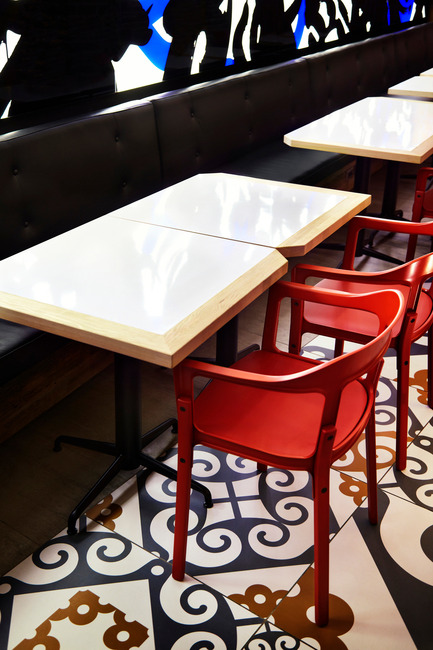Press kit | 1048-09 - Press release | Spanish-inspired tapas restaurant Barsa Taberna captures the energy of the running of the bulls - +tongtong - Commercial Interior Design - Detail of custom table design by +tongtong.&nbsp; Red dining chairs - Magis Steelwood chair supplied by&nbsp; Herman Miller<br> - Photo credit: Lisa Petrole Photography<br>