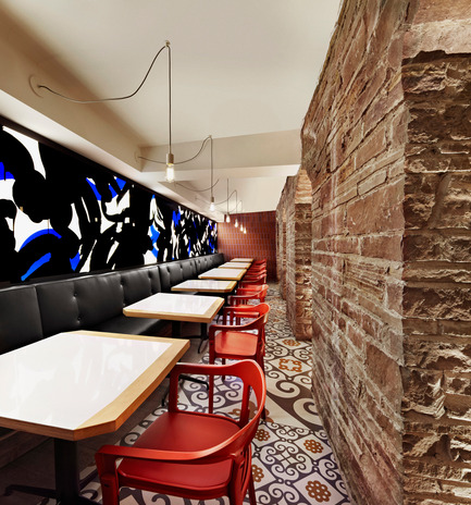 Press kit | 1048-09 - Press release | Spanish-inspired tapas restaurant Barsa Taberna captures the energy of the running of the bulls - +tongtong - Commercial Interior Design - To conserve the limited space, +tongtong knew they needed to integrate a light source into the project spatially.&nbsp; Their solution works double duty: the main light source is a rear-lit mural, a collaboration between local graffiti artist Pascal Paquette and Tong. Like the armatures above the bar, the running of the bulls is the central theme<br> - Photo credit: Lisa Petrole Photography<br>
