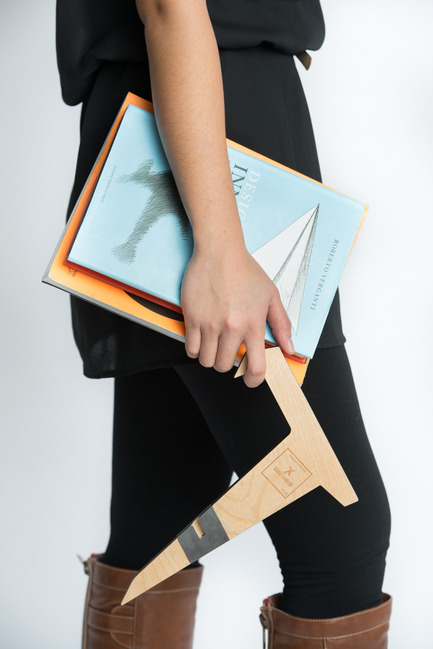 Press kit | 884-04 - Press release | HEC Project 2014 Edition - Faculté d'aménagement de l'Université de Montréal - Industrial Design -   Élément X<br><br>Two  Russian birch plywood L shapes embed themselves to form a book or  tablet stand. Two widths are possible depending on the direction of  embedding and portability is made easy by the presence of magnets. <br><br>[Recipient of the prize of the product towards a commercialization.]<br><br>Charles-Philippe Lepage<br>Thomas Ho<br>Olivier Ouimet   - Photo credit: Olivier Ouimet 2014 - www.olivierouimet.com