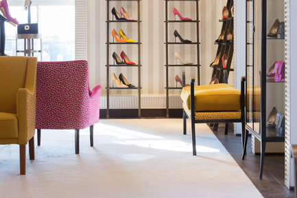 Press kit | 1555-01 - Press release | High Style in Shoe Heaven - Nick Leith-Smith Architecture + Design - Commercial Interior Design - Shoes are presented on sliding library ladders that line the walls - Photo credit: Quintin Lake