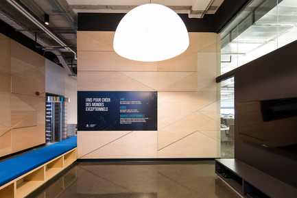 Press kit | 1152-08 - Press release | Four-Season Work and Play Areas at Ubisoft Quebec City - LumiGroup - Commercial Interior Design -  FontanaArte Lighting: Avico; Big-impact suspension lamp, spectacular thanks to its large sizes, available in 120 and 160 centimetre diameters. Polyethylene diffuser in white, black and, on request, also in silver and gold. White inside for all versions. Also available in an outdoor version. A lower disc that covers and hides the light sources is sold as an accessory.  - Photo credit: Jonathan Robert