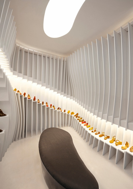 Dossier de presse | 1124-13 - Communiqué de presse | World Interiors News Awards Ceremony 2016 - World Interiors News - Design d’intérieur commercial - JOINT WINNER: RETAIL INTERIORS (LESS THAN 200 SQUARE METRES)&nbsp;<br>Importance of Walking Store by Praxis d’Architecture<br><br>An unexpected situation with the lease required the design for the space to be as economical as possible and fast to build. Furthermore, the shoe shelves were intended to be self-supporting, movable and ready for re-assembling. Effectively an independent piece of furniture, the installation could be moved easily and with minimal wastage.&nbsp;<br><br>JUDGES’ COMMENT<br>'It’s notoriously difficult to display shoes, but the storage system they have used does the job and makes the space dramatic and dynamic at the same time. Using a simple stepped element is a designed piece that can be easily manufactured and installed and has created a unified environment that is both flexible and incredibly exciting.' - Crédit photo : Praxis d’Architecture<br>