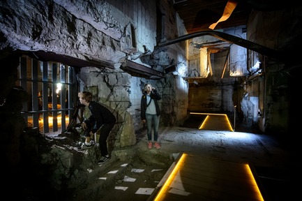 Press kit | 1997-04 - Press release | TIRPITZ, a 'Hidden Museum' on Danish West Coast - BIG - Bjarke Ingels Group and Tinker imagineers - Event + Exhibition -                From the sunken galleries, visitors are able to walk into the historic bunker, which grounds the tale of an impressive war machine.&nbsp; - Photo credit: Mike Bink Photography