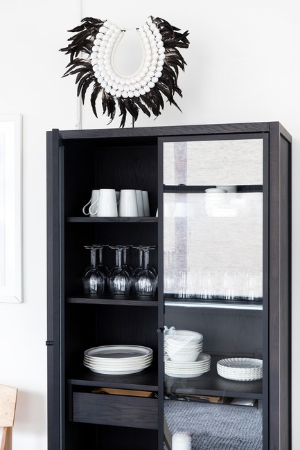 Press kit | 1122-05 - Press release | Purchasing a Kitchen Online is Now Child’s Play with coquo.ca - Coquo by Cuisines Steam - Product -   A close-up of coquo's Volitare armoire with glass doors shown in midnight black stained oak in the Witness Apartment kitchen.&nbsp;   - Photo credit:  Jessica Nash 