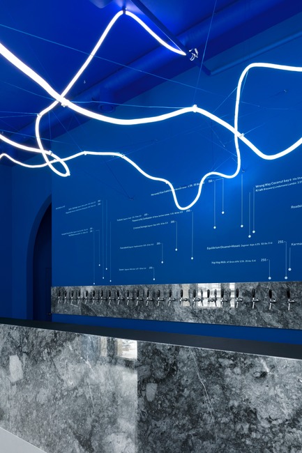 Press kit | 2247-04 - Press release | Galaxy Bar and Bottle Shop - Maxim Kashin Architects - Commercial Interior Design - Grey marble counter, blue walls and neon flex light installation - Photo credit:  Dmitry&nbsp;Chebanenkov 