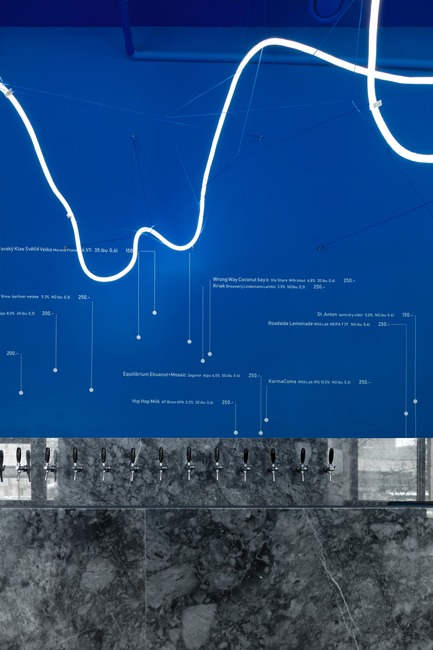 Press kit | 2247-04 - Press release | Galaxy Bar and Bottle Shop - Maxim Kashin Architects - Commercial Interior Design -  Neon flex light installation with grey marble counter and 'himmelblau' blue walls  - Photo credit:  Dmitry&nbsp;Chebanenkov 