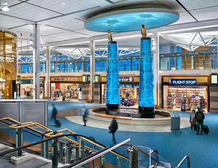 Press kit | 2124-02 - Press release | IESBC Announces its 2018 ‘Vision Awards’ for Best Lighting Design in BC, Canada - IESBC - Lighting Design - Vancouver International Airport A-B Connector -&nbsp;        The glass totem artworks and "sky" above are illuminated by internal 4000K LED spotlights and the Eagles are illuminated by RGBW LED projectors with gobos. - Photo credit:         Ed White Photography