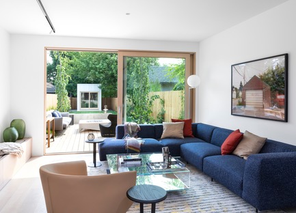 Press kit | 1876-01 - Press release | Unlikely Vancouver Lot Spurs Innovative House Design by Falken Reynolds Interiors - Falken Reynolds Interiors - Residential Interior Design - Living Room - Bensen Endless Sectional in Kvadrat Raf Simons fabrics; Lift &amp; Slide door to patio and garden beyond - Photo credit: Ema Peter