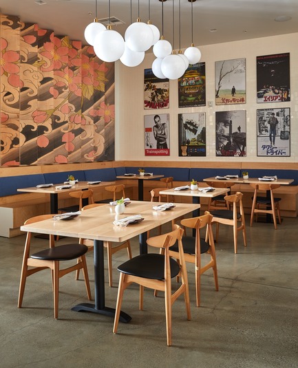 Press kit | 2757-07 - Press release | Ancient Art of Japanese Tattooing Inspires Latest Little Tokyo Restaurant in Los Angeles - Wick Architecture & Design + LAND Design Studio - Commercial Architecture -  In the main dining area, design collaborators David Wick and Andrew Lindley juxtaposed the tattoo art with a display of Japanese language versions of American movie posters.  - Photo credit: Nicole LaMotte Photography<span></span>